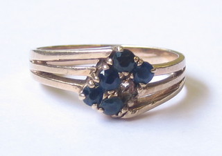 A lady's 9ct gold dress ring set 6 blue stones