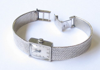A lady's Jaeger Le Coutre wristwatch contained in an 9ct white gold case and with integral bracelet