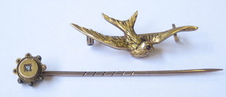 A French gold bar brooch in the form of a bird together with a stick pin