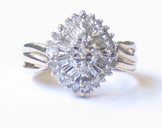 A gold cluster dress ring set numerous diamonds