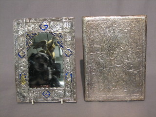 A pair of Persian Qajar mirrors contained in embossed silver frames 8 1/2" x 6"