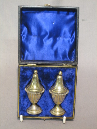 A pair of silver plated pepperettes, boxed