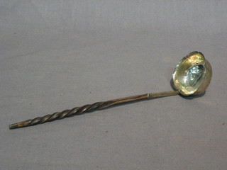 A Victorian silver toddy ladle with whale bone handle London 1856