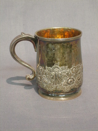 An antique embossed silver tankard 6 ozs