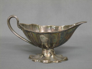 A 19th Century shaped silver plated sauce boat