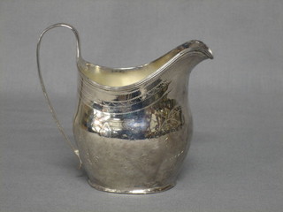 A Georgian silver cream jug with engraved decoration, marks rubbed, 3 ozs