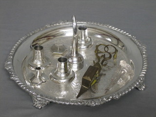 A circular engraved silver plated salver, 4 various sconces, a silver wine funnel spout, a small pricket candlestick, a pair of gilt metal snuffers and 2 glass sugar crushers