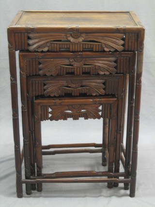 A nest of 4 Oriental Padouk wood interfitting coffee tables