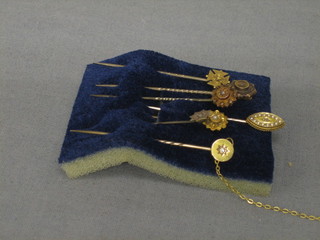 7 various gilt metal stick pins