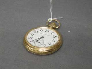 An open faced pocket watch  by Hampden contained in a 14ct gold case