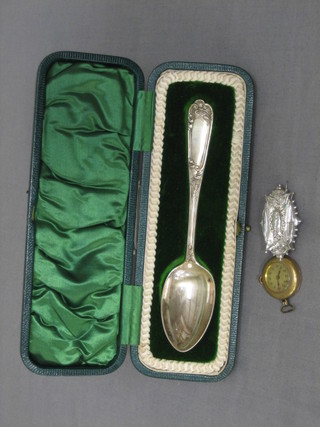 A silver christening spoon, a Victorian embossed silver brooch and a gilt metal wristwatch