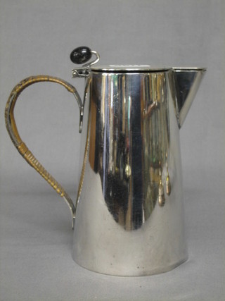A silver plated hotwater jug with bean finial