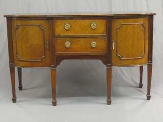 A 19th Century Georgian style mahogany sideboard fitted 2 drawers flanked by a pair of cupboards, raised on square tapering supports ending in spade feet 60"