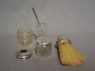 A Victorian embossed silver handled table brush, a silver handled fruit knife  and 3 cut glass dressing table jars, 1 with embossed silver lid
