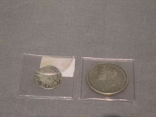 An Elizabeth I hammered silver coin (f) together with a George III silver crown 1882 (f)