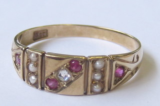 A lady's 18ct gold dress ring set 4 rubies, 1 diamond and 6 pearls