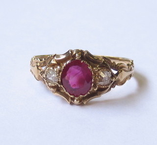 A lady's 18ct yellow  gold dress ring set an oval cut ruby and 2 diamonds
