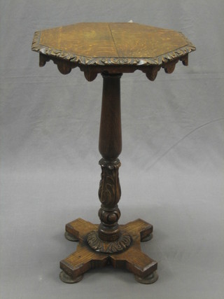 A William IV carved oak octagonal wine table raised on carved column with X framed base 17"