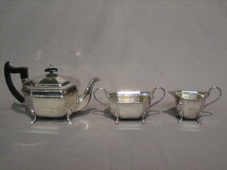 An octagonal silver plated 3 piece tea service comprising teapot, twin handled sugar bowl and cream jug