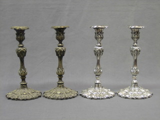 A handsome set of 4 of 19th Century Rococo style silver plated candlesticks with detachable sconces 10"