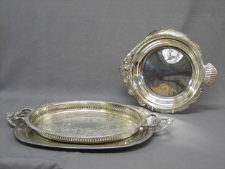 An oval engraved silver plated twin handled tea tray 18", a galleried ditto 16", a silver plated dish in the form of a fish 14"