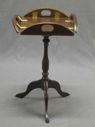 A Georgian style mahogany butler's wine table, raised on a turned tripod support 11"  
