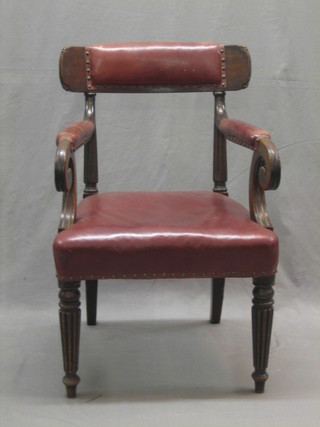 A William IV mahogany open arm bar back desk chair raised on turned and reeded supports (back f and r)