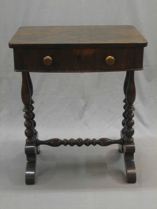 A Victorian mahogany work table fitted a drawer and raised on turned supports united by an H framed stretcher 24"