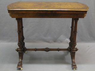 A Victorian inlaid figured walnut card table, raised on a turned column with H framed stretcher 36"