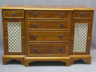 A 20th Century Georgian style yew wood sideboard fitted 4 long drawers flanked by a pair of cupboards enclosed by grilled panelled doors, raised on bracket feet 45"
