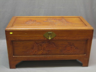 A 20th Century Hong Kong carved camphor wood coffer with hinged lid 36"