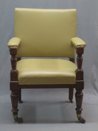 A Victorian open arm chair raised on turned supports by Gillow, the back legs marked Gillow 11047