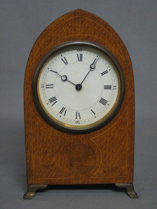 An Edwardian French 8 day bedroom timepiece with paper dial and Roman numerals, contained in an arched mahogany lancet case