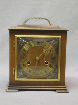 A 1950's striking bracket clock with gilt dial and Roman numerals contained in a square walnut case by Enfield