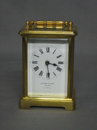 A 19th/20th Century 8 day carriage clock with enamelled dial and Roman numerals by B Leefe & Sons of Malton