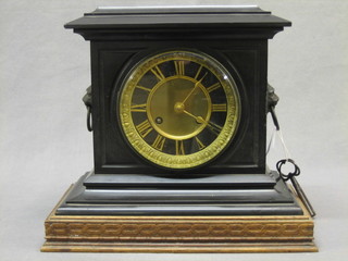 A Victorian French 8 day striking clock with Roman numerals contained in a black marble case