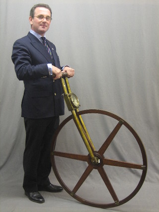 An 18th Century Waywiser by Troughton & Simms with silvered dial, brass frame and iron clad wheel