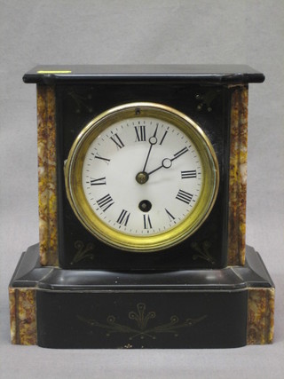 A Victorian 8 day mantel clock with enamelled dial and Roman numerals contained in a black slate and green marble case