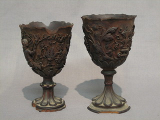 A pair of 19th Century carved lime wood goblets carved cherubs amidst fruit, 6" (some damage and chips)