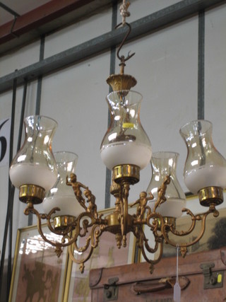 A 20th Century gilt metal 5 light electrolier decorated cherubs