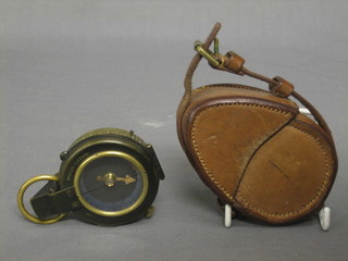 A WWI prasmatic compass no. 227245 dated 1918 contained in a leather carrying case