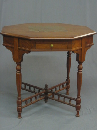 A 19th/20th Century octagonal Eastern hardwood games table, the top inlaid a chessboard, fitted 2 drawers and 2 cup receptacles, raised on turned supports united by an X framed stretcher with bobbin turned decoration 30"