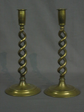 A pair of 19th Century brass candlesticks with spiral columns 12"