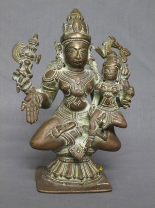 A gilt bronze figure of a seated Eastern Deity 8"