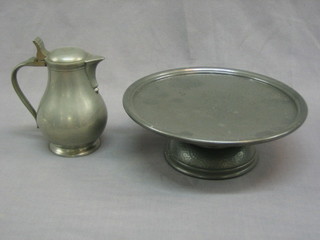 A circular planished pewter comport 9 1/2" together with a modern Dutch pewter baluster lidded jug 6"