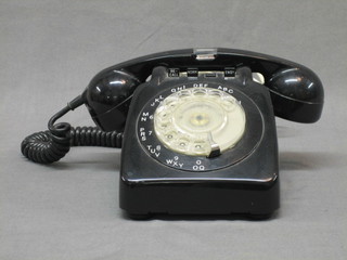 An old black dial telephone, converted for modern connection