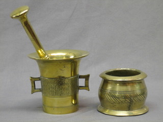 An 18th/19th Century brass mortar and pestle 6" and a 4" brass mortar