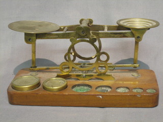 A pair of brass postage scales by S Morden and 2 weights