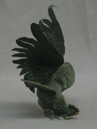 A bronze table ornament in the form of a standing fighting cock 10"