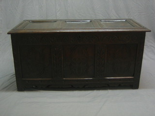 A 17th/18th Century carved oak coffer of panelled construction with hinged lid 51"   